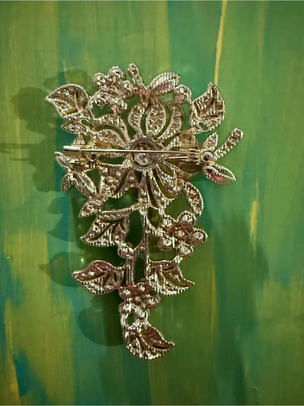 Pink Crystal Floral Brooch with Green Accent Leaves
